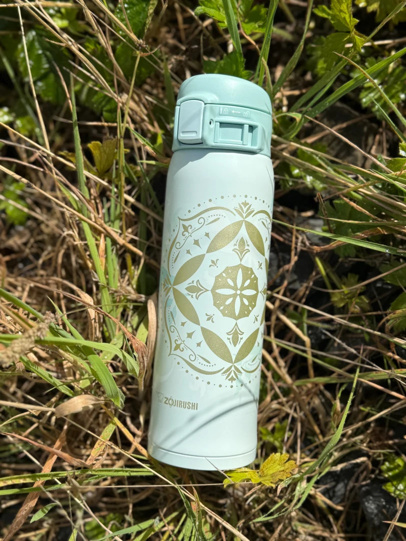 Zojirushi SM-SG48 Mint travel mug with golden pattern in the grass, outdoor nature scene, Ireland