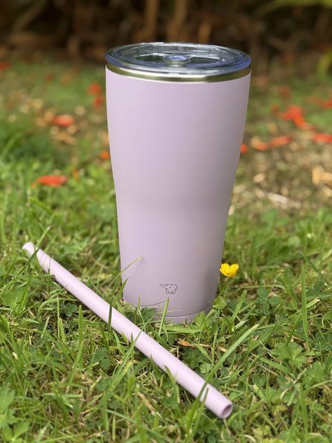 pink straw tumbler on the grass